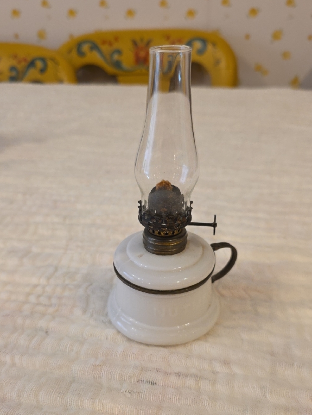 Antiquite nutmeg oil lamp with hurricane.